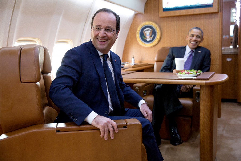 President Barack Obama and President François Hollande of France travel aboard Air Force One en route to Charlottesville, Va., Feb. 10, 2014. (Official White House Photo by Pete Souza) This official White House photograph is being made available only for publication by news organizations and/or for personal use printing by the subject(s) of the photograph. The photograph may not be manipulated in any way and may not be used in commercial or political materials, advertisements, emails, products, promotions that in any way suggests approval or endorsement of the President, the First Family, or the White House.