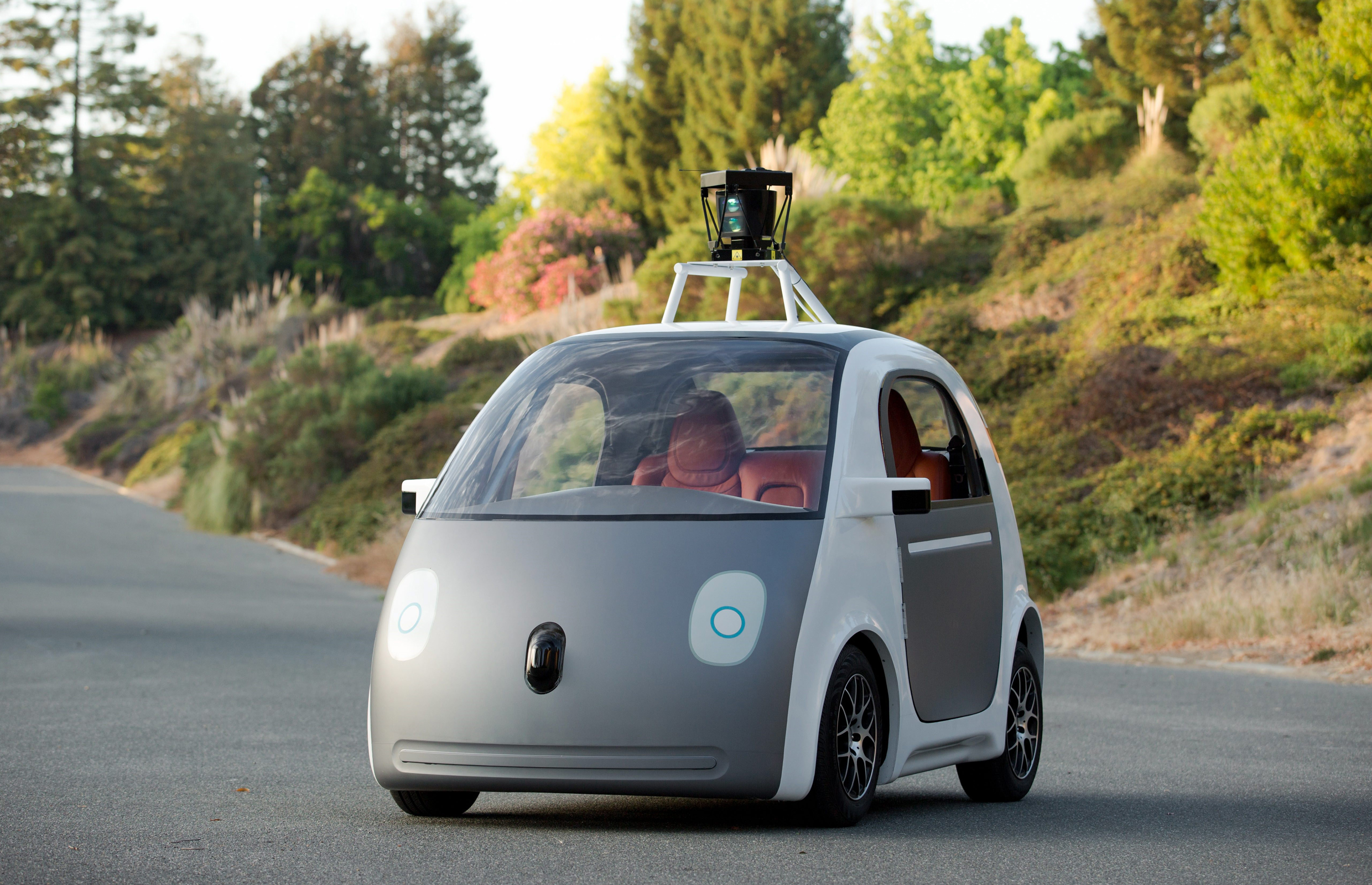 This image provided by Google shows a very early version of Google's prototype self-driving car. The two-seater won't be sold publicly, but Google on Tuesday, May 27, 2014 said it hopes by this time next year, 100 prototypes will be on public roads. (AP Photo/Google)